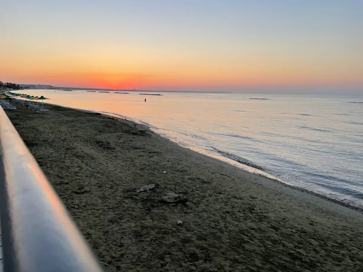 Sunset over the beach promenade near Oroklini Beach House