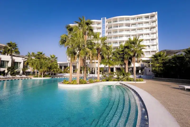 Radisson Beach Resort pool with palm trees